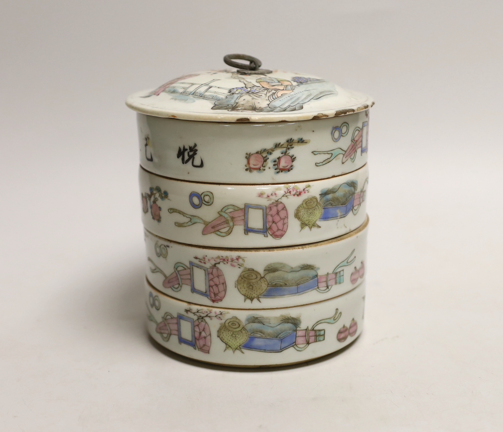 An early 20th century Chinese four section food container hand painted in the famille rose palette, 14cm high